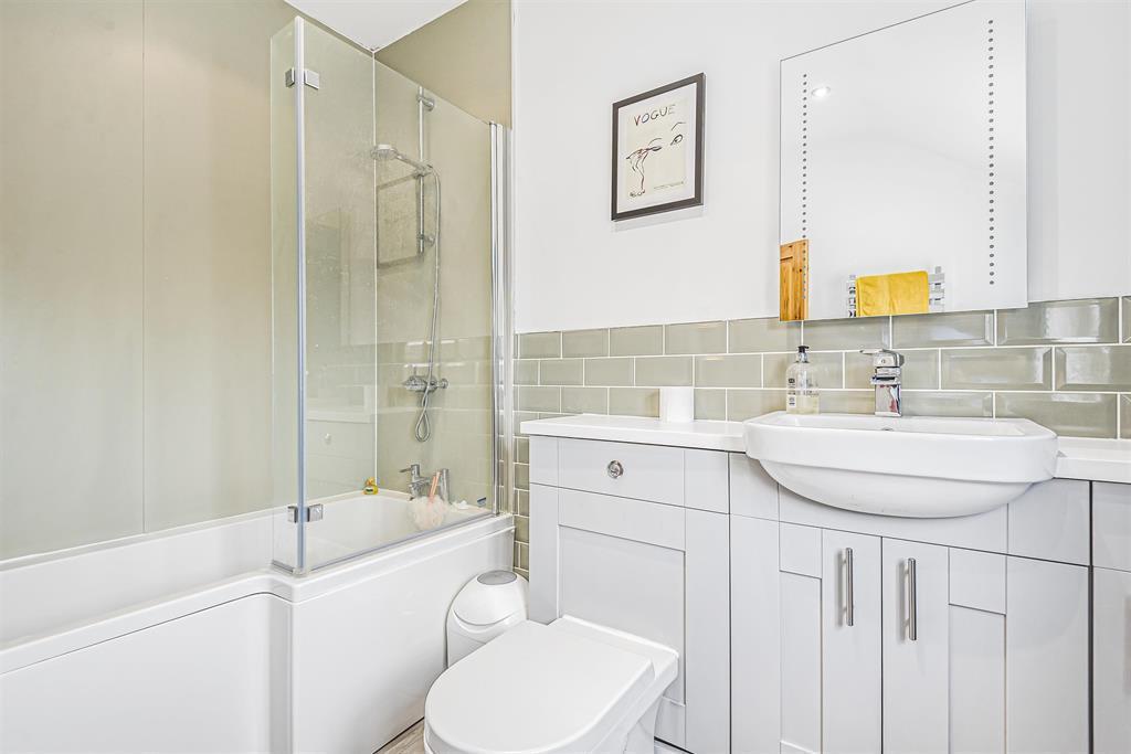 Bathroom with separate shower over