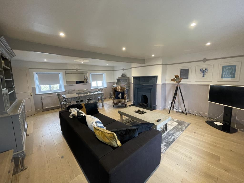 Refurbished living room with fireplace