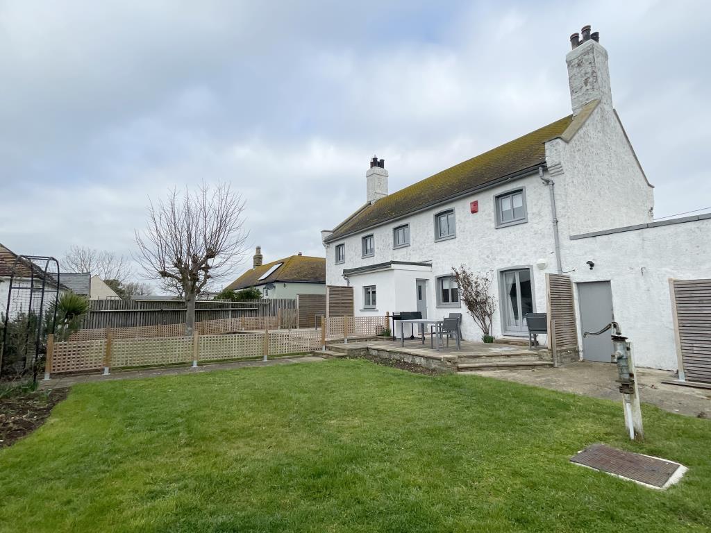 Rear view of property with gardens