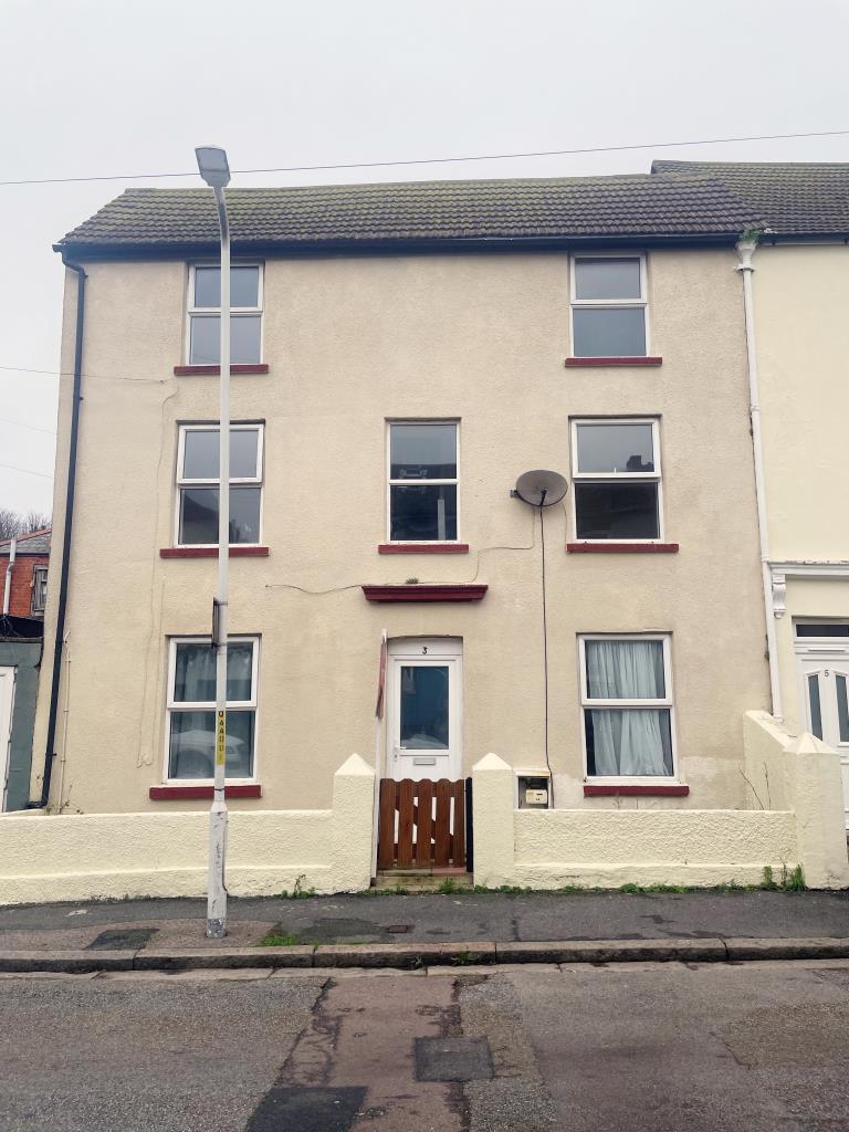 End terrace building over three floors