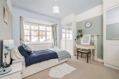 25 Charminster Avenue, London, SW19 3EL