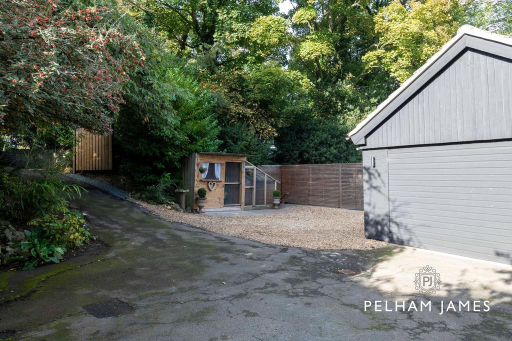 Gates leading to driveway parking, The...