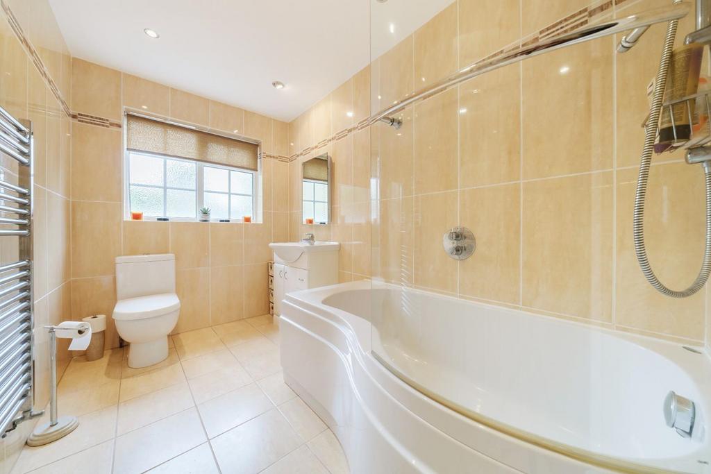 Bathroom with shower over