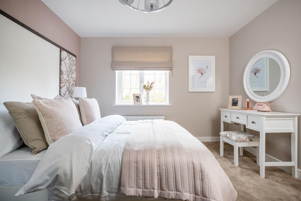 Bedroom 2 offers space for a double bed and...