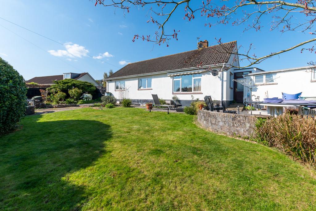 Enclosed rear garden with dining terrace