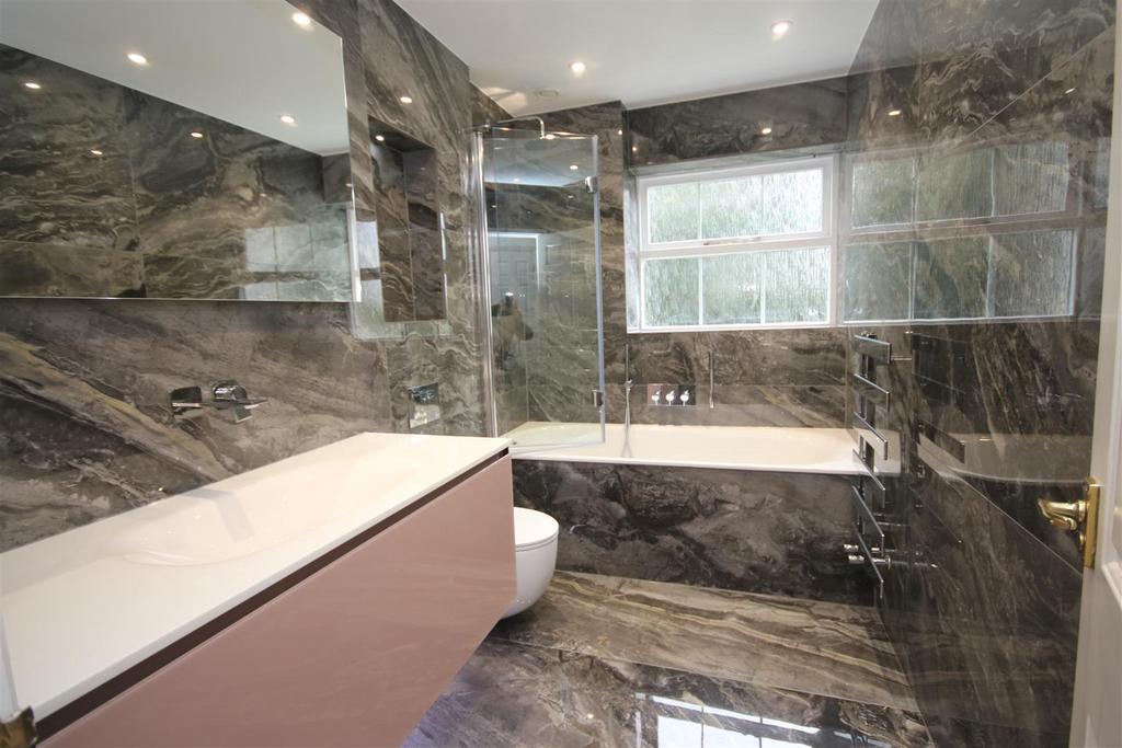 Fully tiled luxury bathroom: