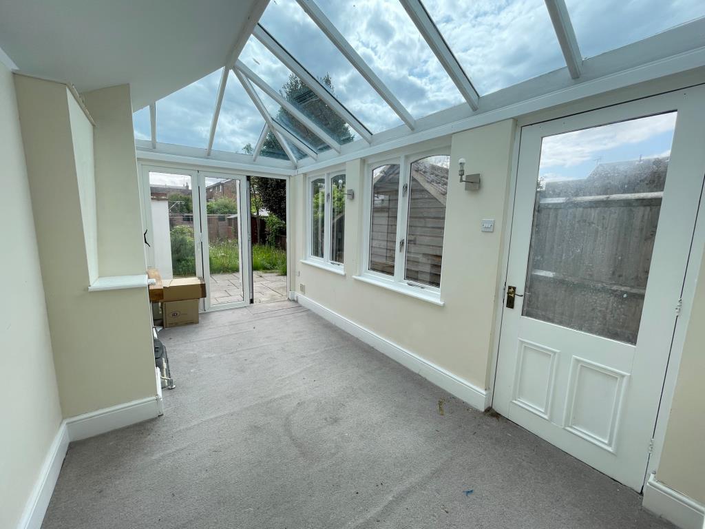 Garden room with glass ceiling and french door to