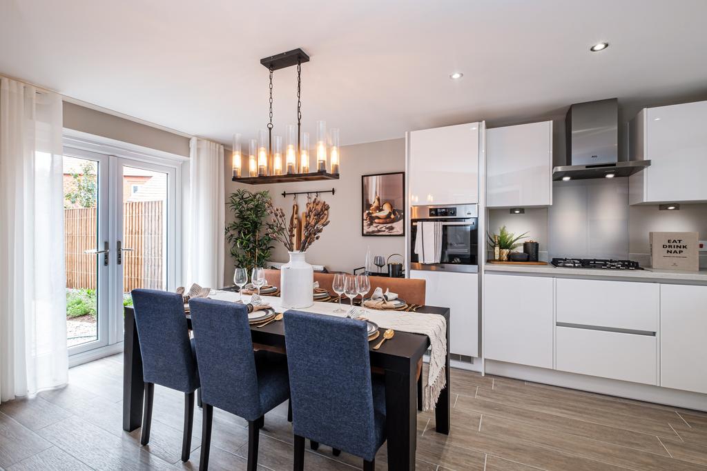 White kitchen with French doors showing the garden