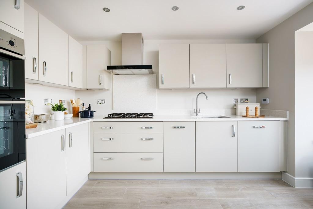 A modern kitchen sits at the front of the property