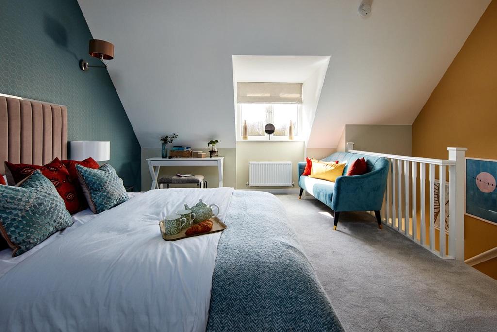 King-size bedroom enjoys privacy on the second...