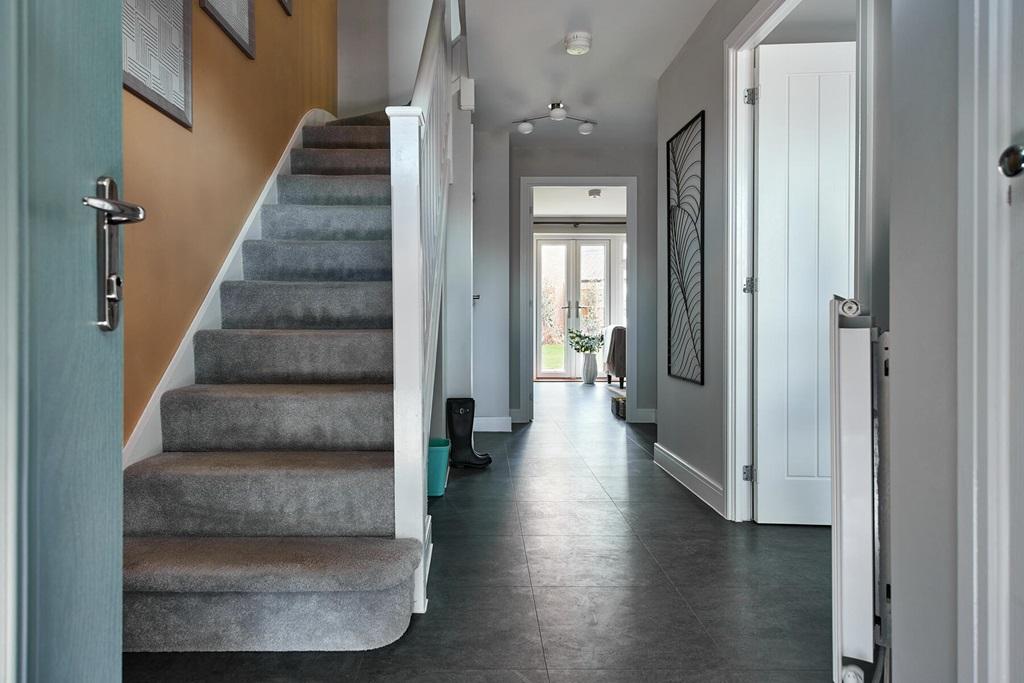 Hallway with convenient storage cupboard and...