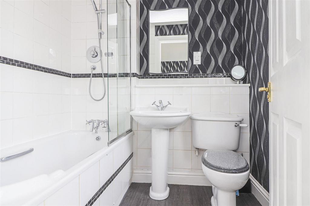 En suite bathroom to bedroom one