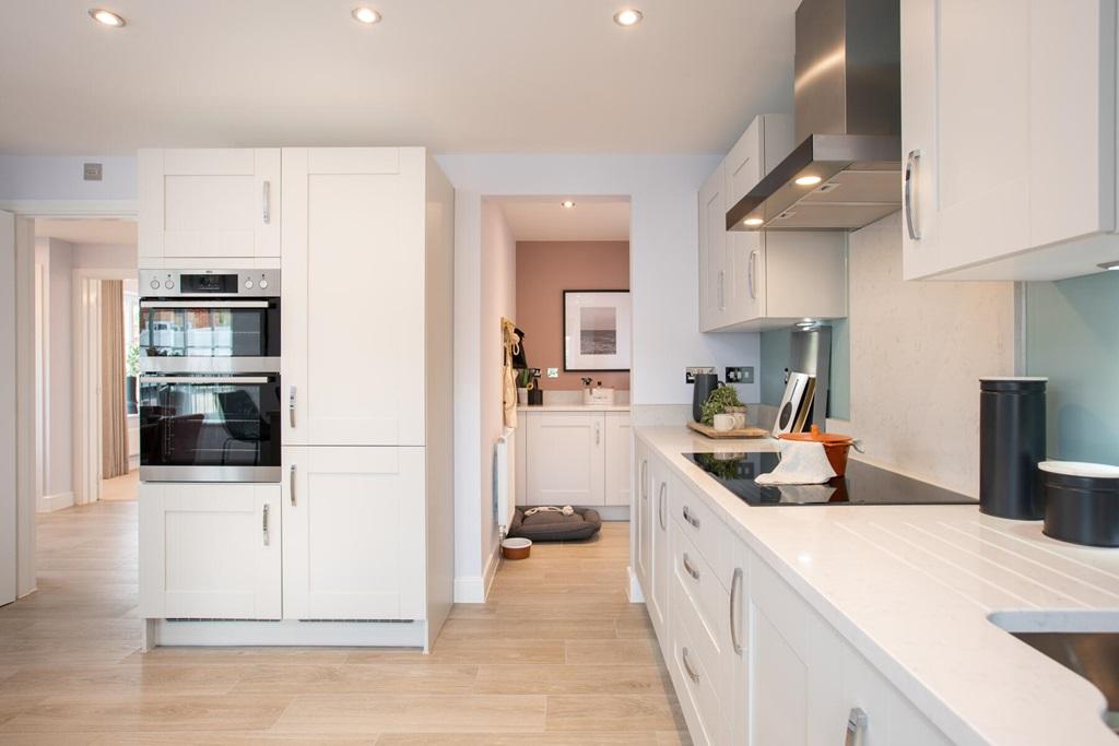 A handy utility space sits off the kitchen