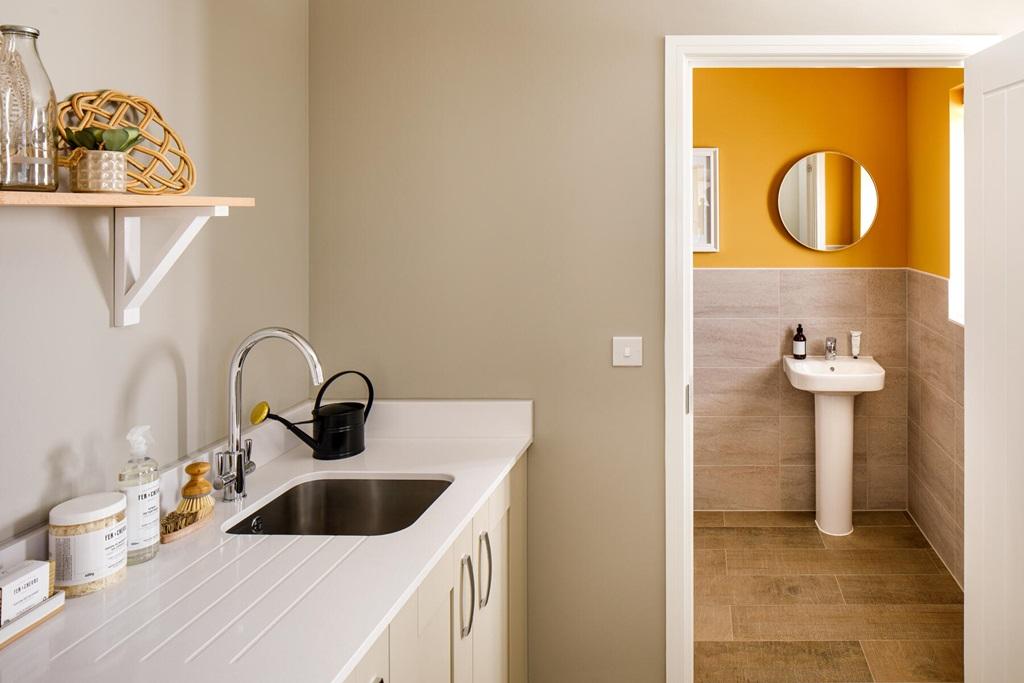 A handy utility room sits off the kitchen/diner