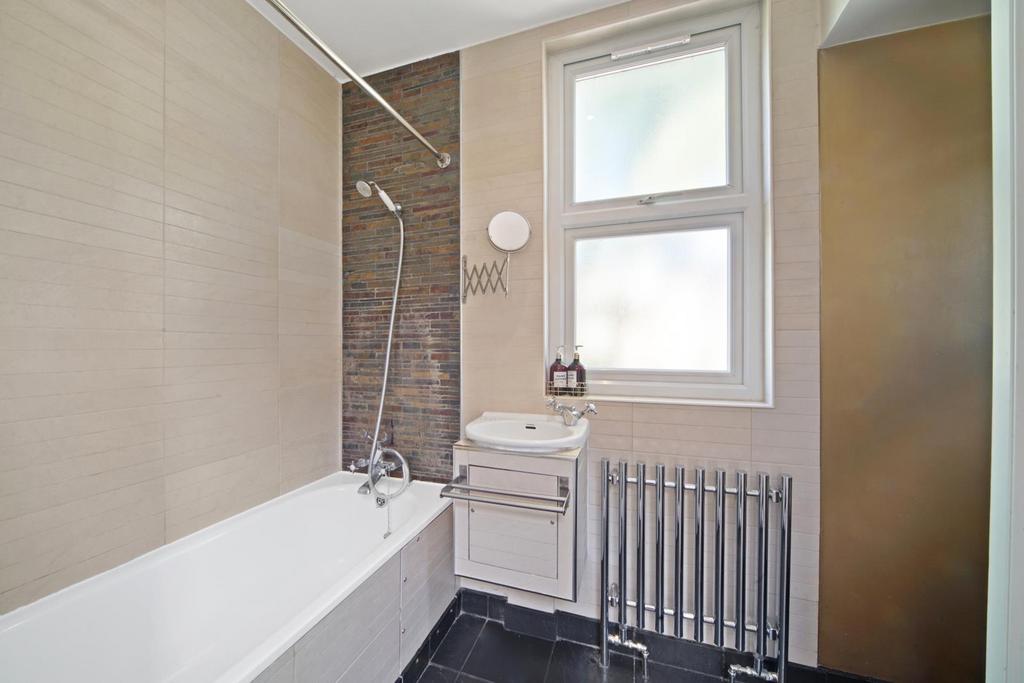 Contemporary style bathroom with chrome radiator