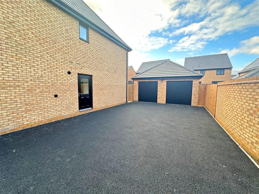 Double Garage and Driveway Parking for up to Four