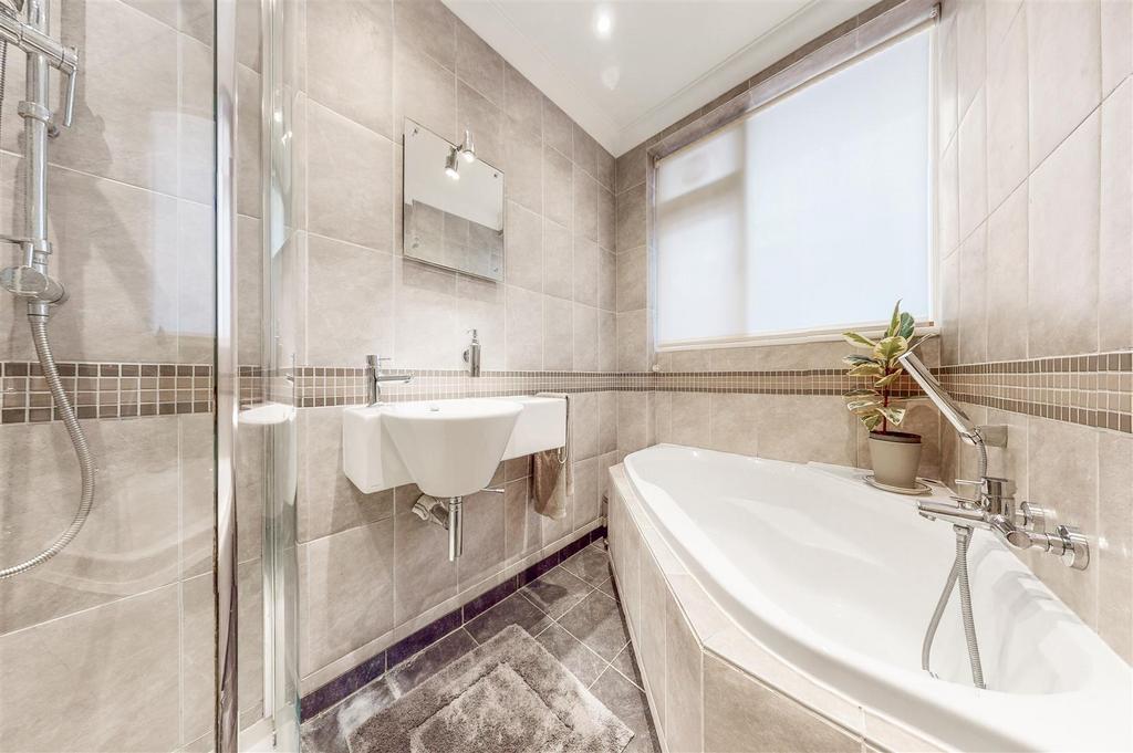 Bathroom room with bath and shower cubical