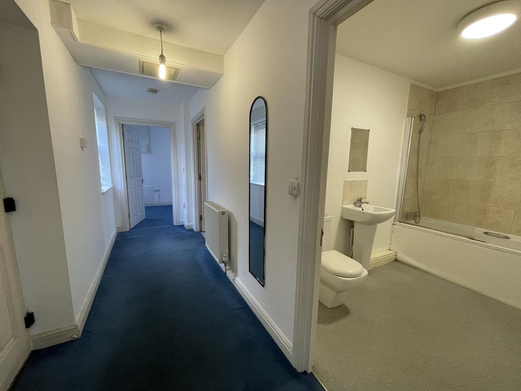 Hallway leading to bedroom kitchen and bathroom