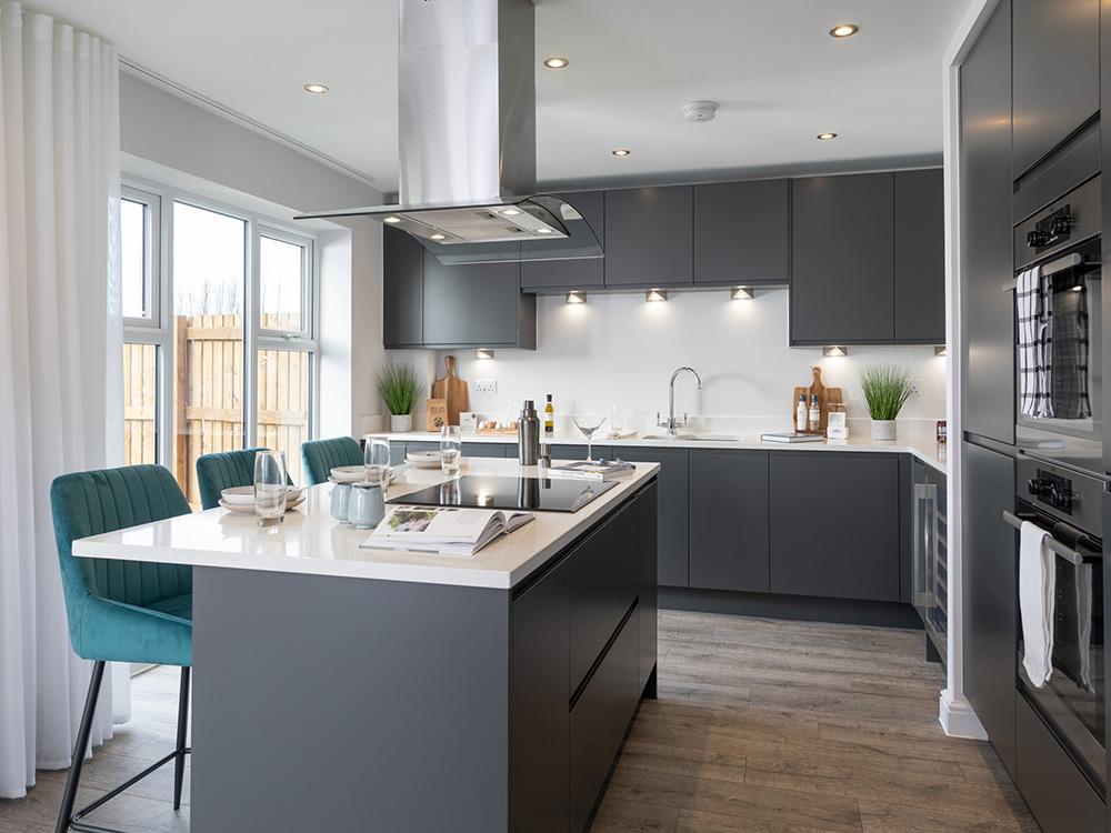 Fully fitted kitchen with a full height window...