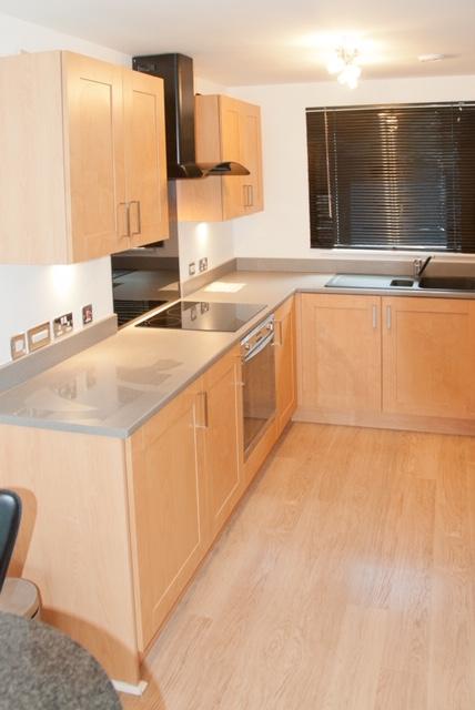 Kitchen with built in hob and oven, integrated...