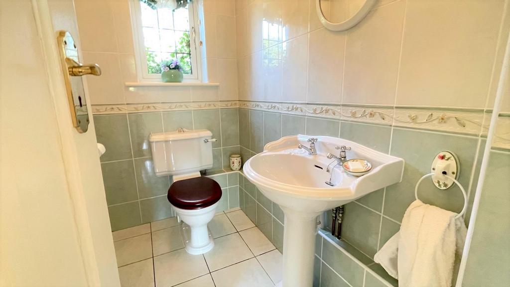 Tiled 2 piece cloakroom