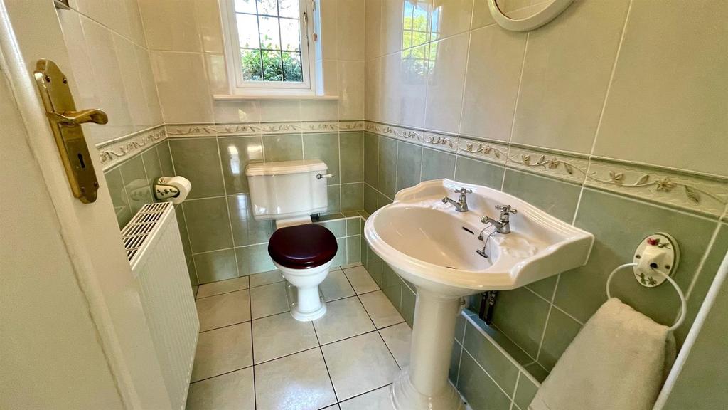 Tiled 2 piece cloakroom