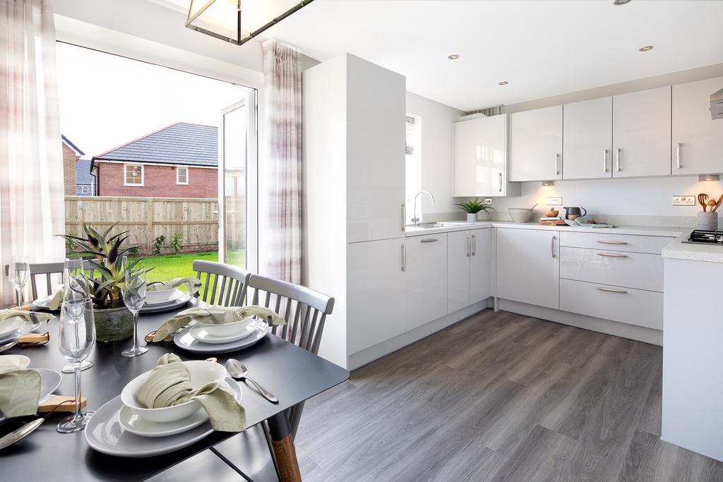 Open plan kitchen with French doors to the...