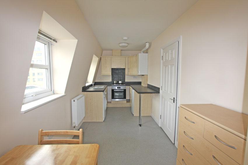 Dining Area with the Kitchen in the background