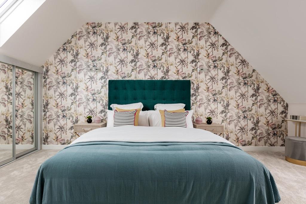 The impressive en suite bedroom occupies the...