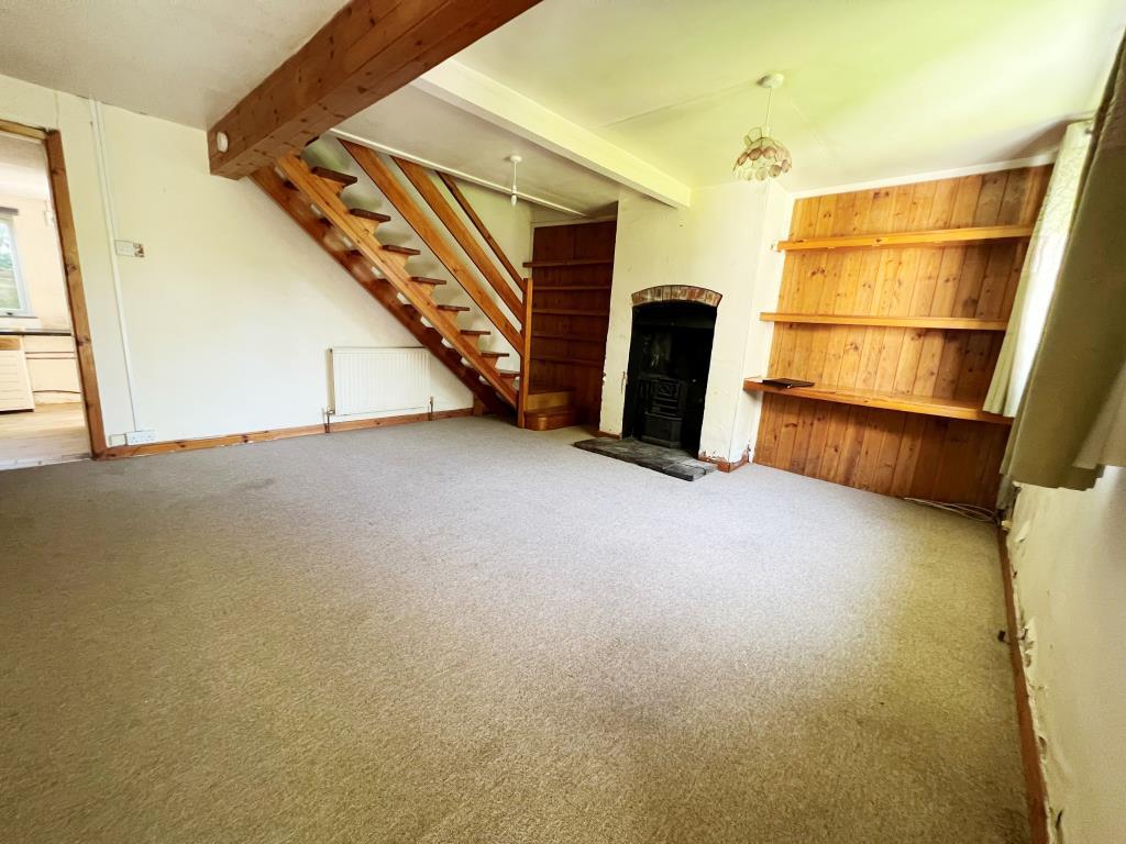 Living room with stairs to first floor