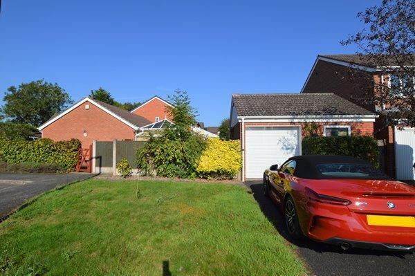 Detached garage with workshop and bungalow