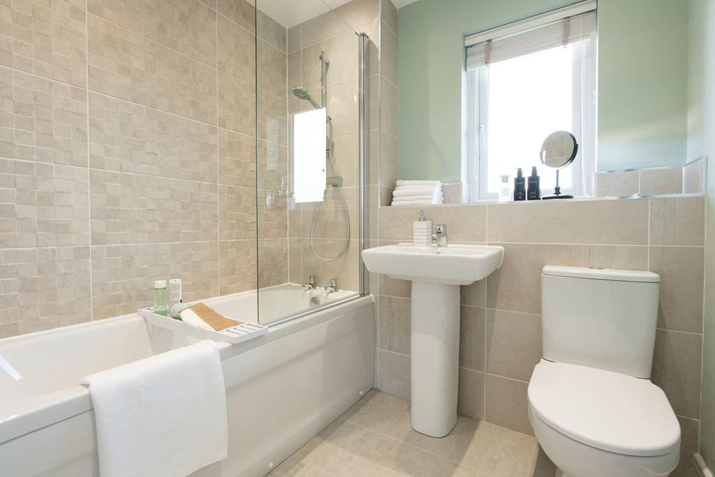 Main bathroom with shower over the bath