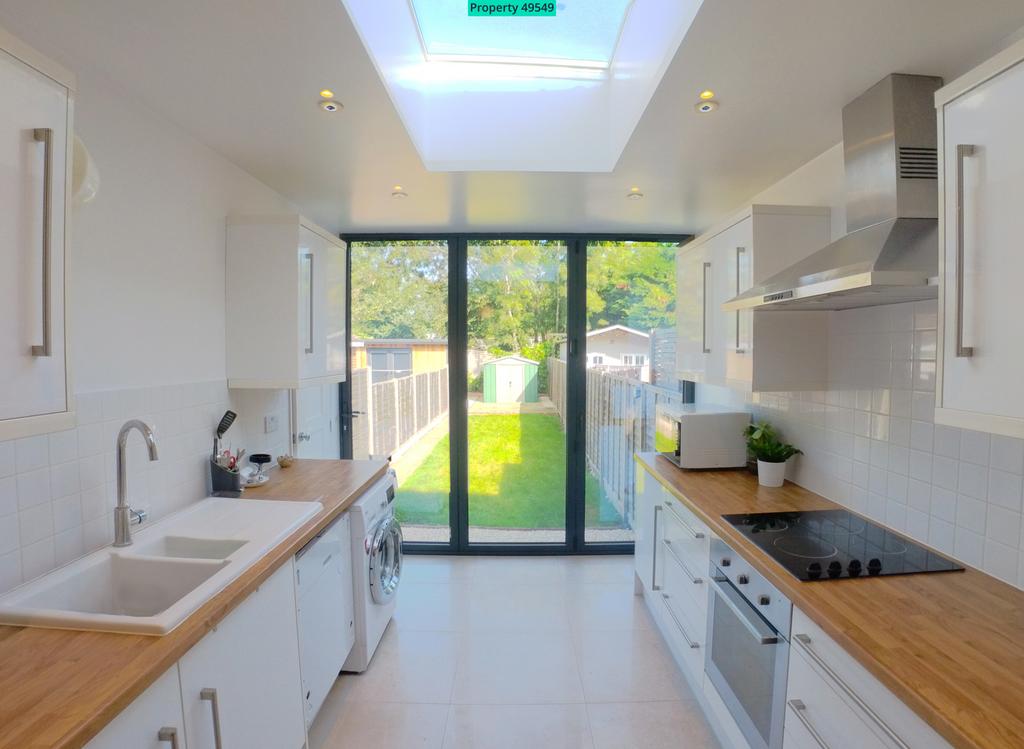 Kitchen w/ trifold doors to private back garden