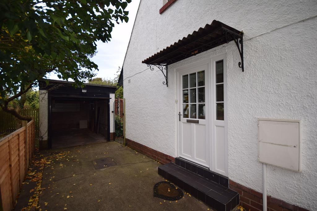 Side entrance and Garage