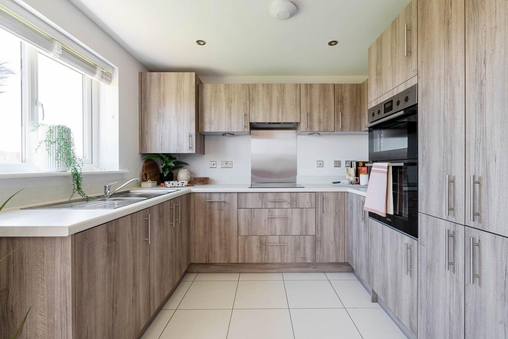The kitchen benefits from ample storage