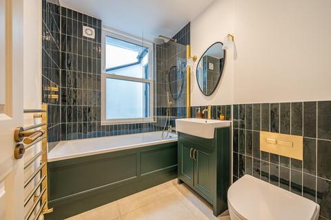 Flat 1, 86a Quicks Road, London, SW19 1EX