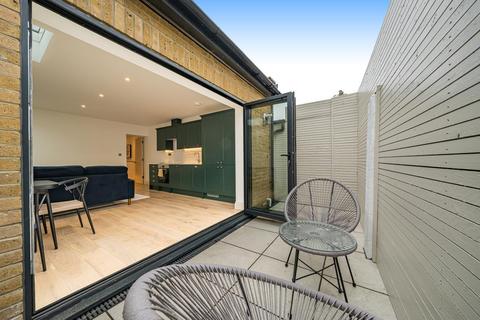 Flat 1, 86a Quicks Road, London, SW19 1EX