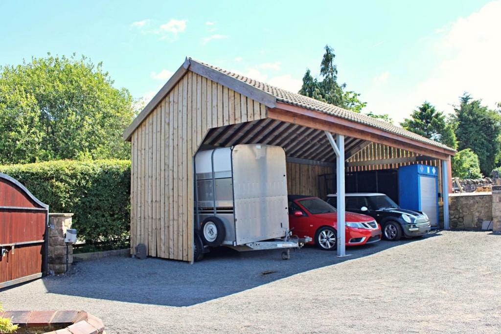 Gated Entrance and Three Car Garage