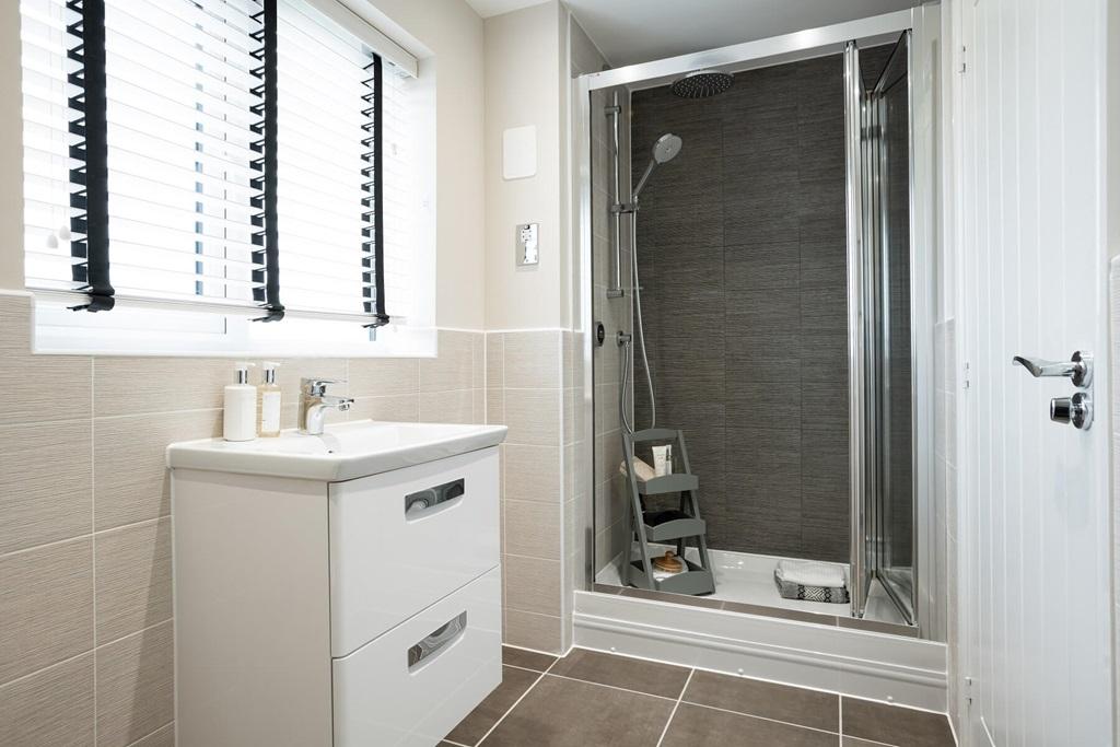 The en suite shower room offers added luxury