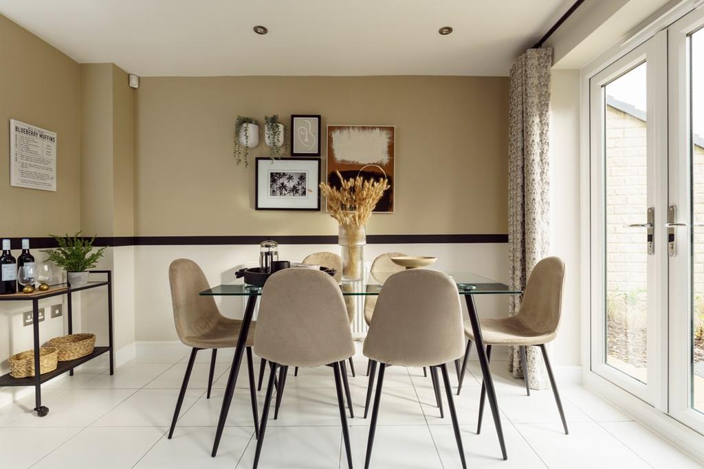 Double doors lead out to the garden from the...
