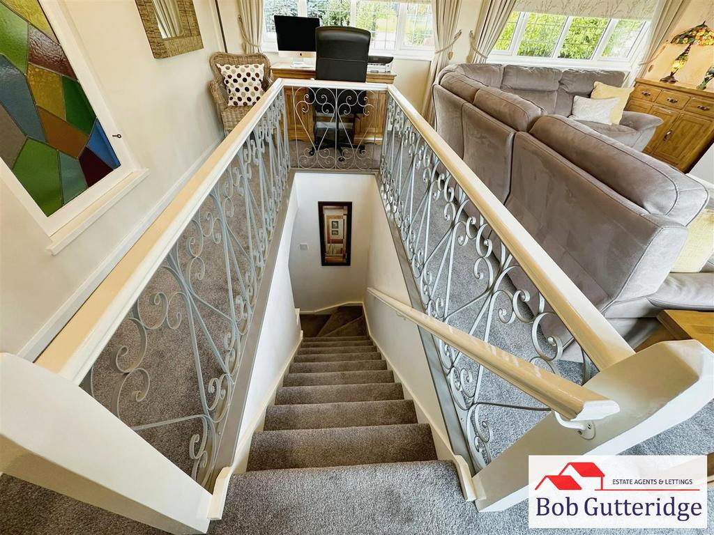 Staircase to dual aspect sitting room