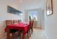 Dining room with a view out to the front of the pr