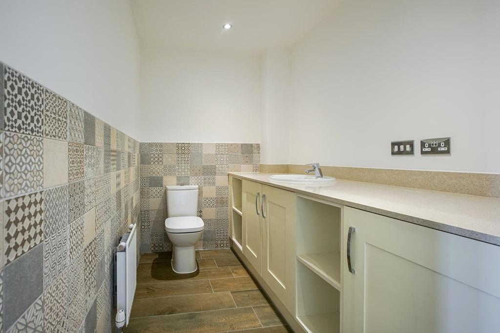 Combined downstairs toilet and laundry room