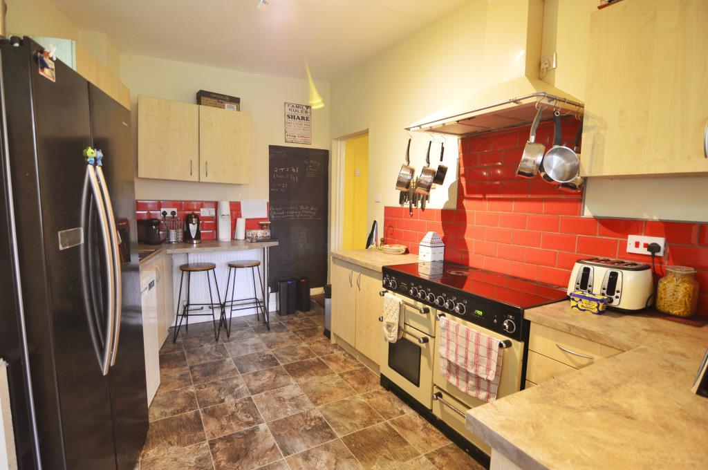 Kitchen leading to utility and WC