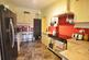 Kitchen leading to utility and WC