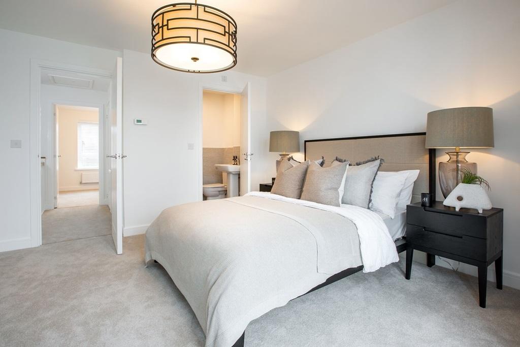 The main bedroom features an en suite for added...