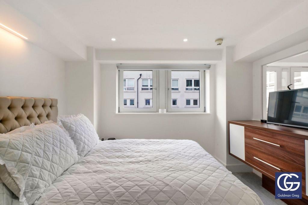 Bedroom with fold up TV