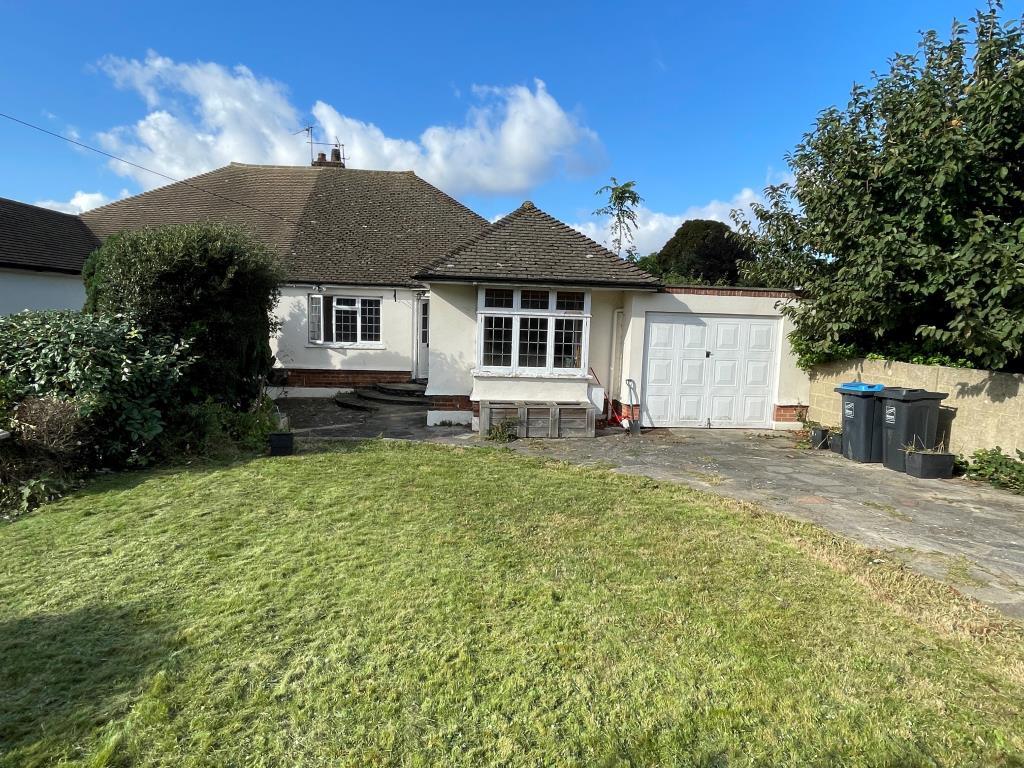 Semi detached bungalow with driveway and garage