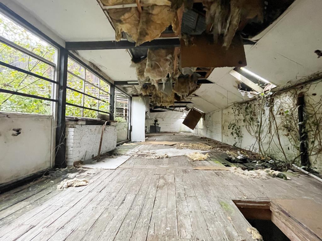 Dilapidated former workshop