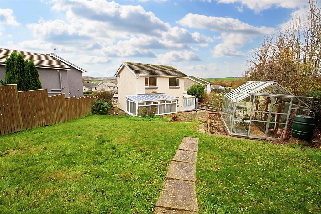 Rear garden and rear view of property